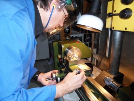 The author behind his small lathe, making a reel part. The author behind his small lathe, making a reel part.