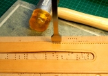 Punching the holes with a diamond stitching chisel Punching the holes with a diamond stitching chisel